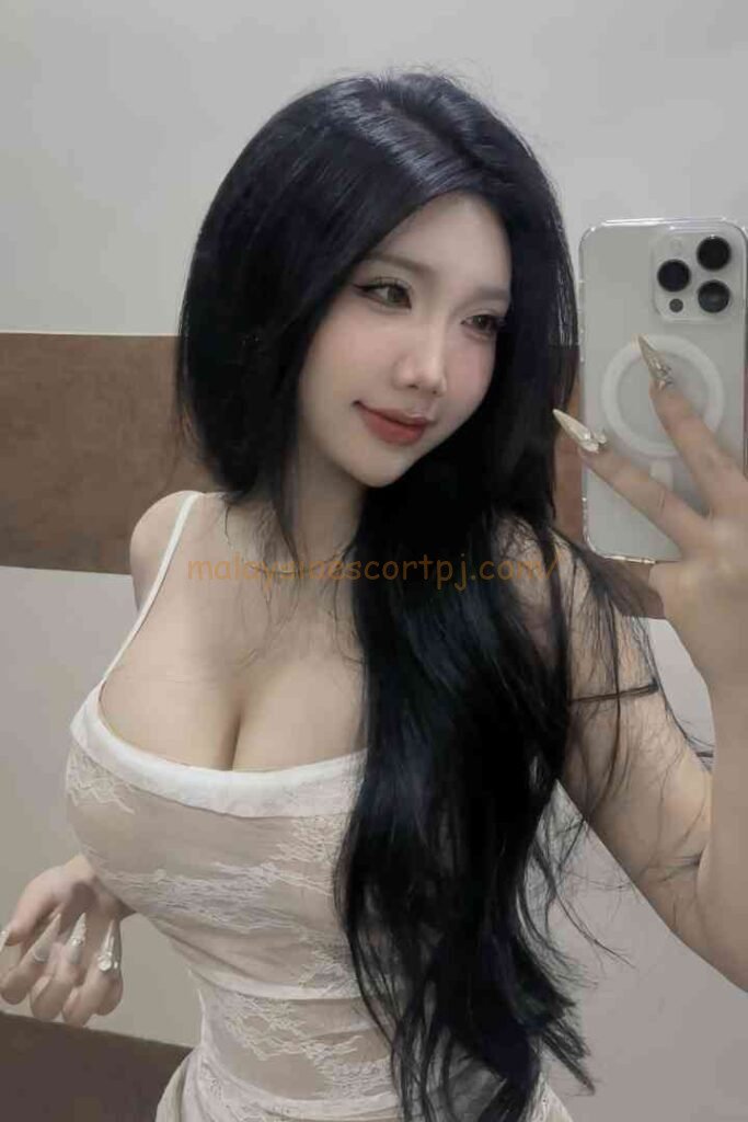 Yumi, a beautiful Vietnamese woman with long black hair, smiles at the camera.