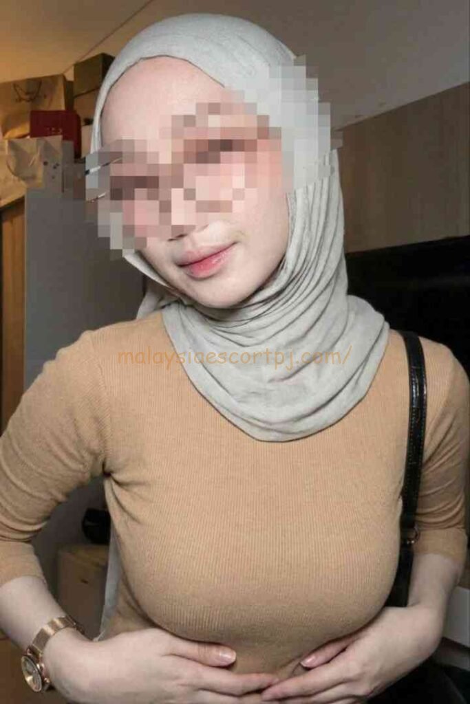Woman in hijab and brown top, Kuala Lumpur
